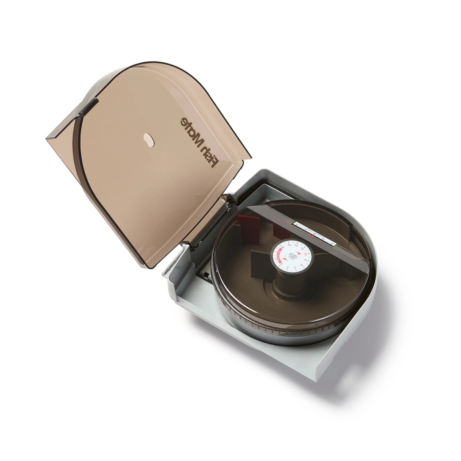 Open view of the feeder displaying the timer dial and the food compartments