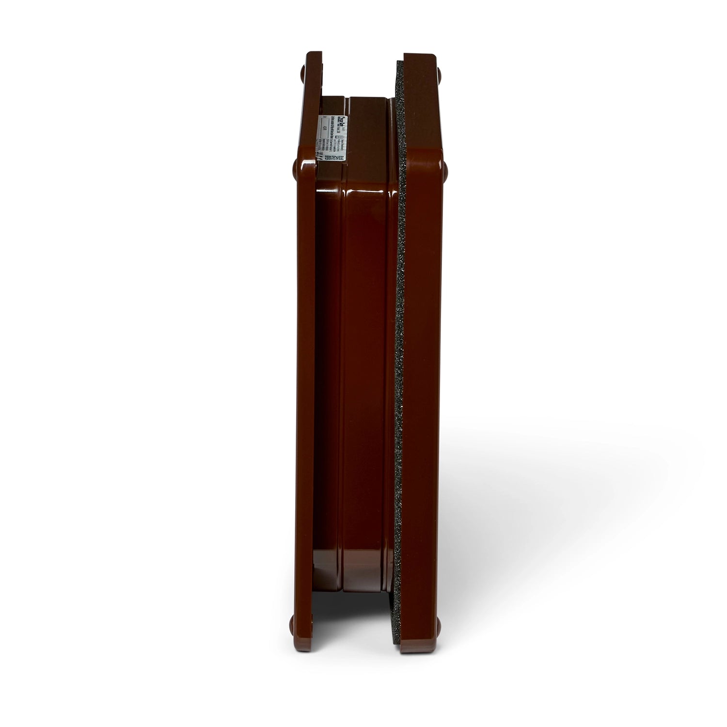 Side on view of a brown cat flap frame with door liner on a white background