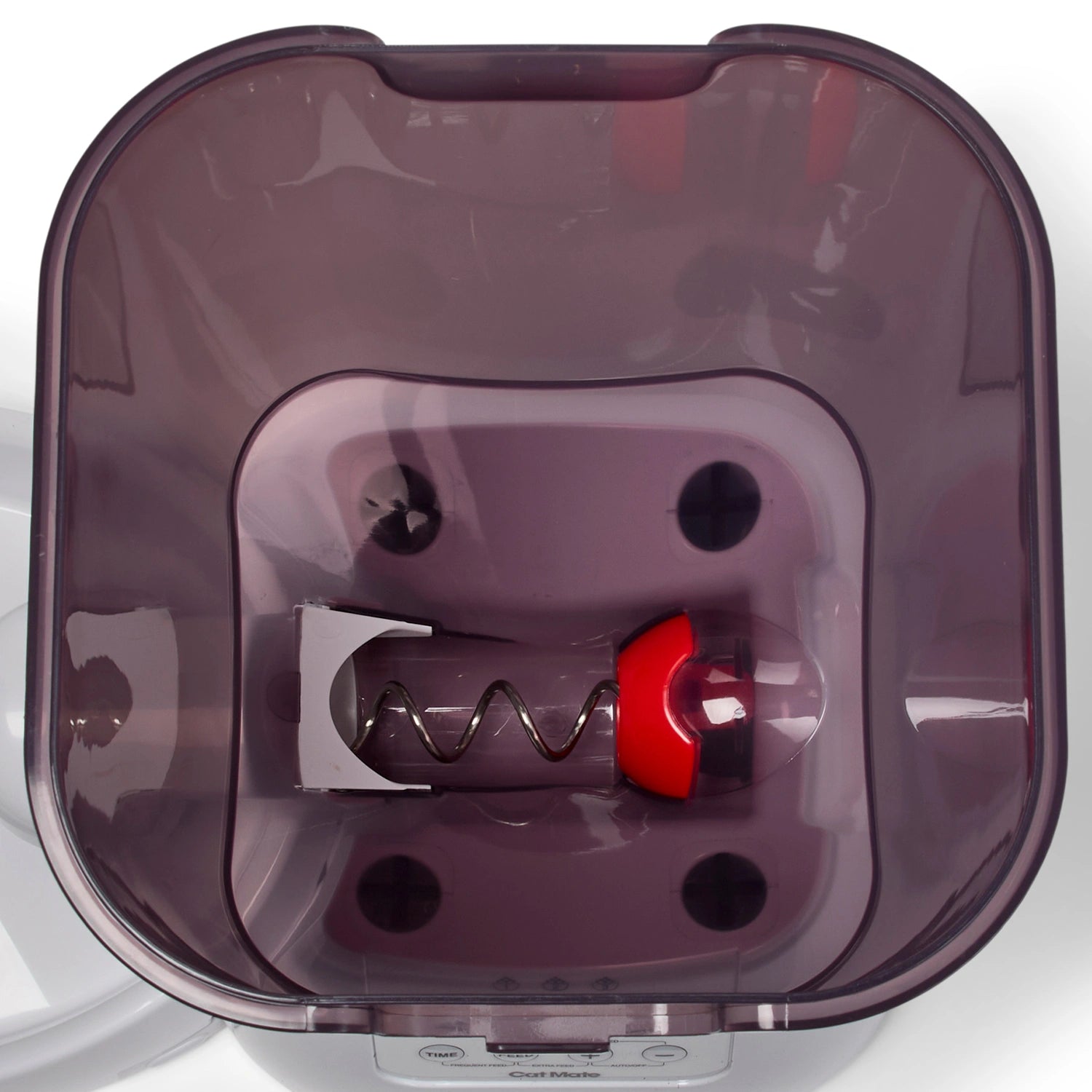 A top down view of the inside of the dark translucent food storage container on a white background