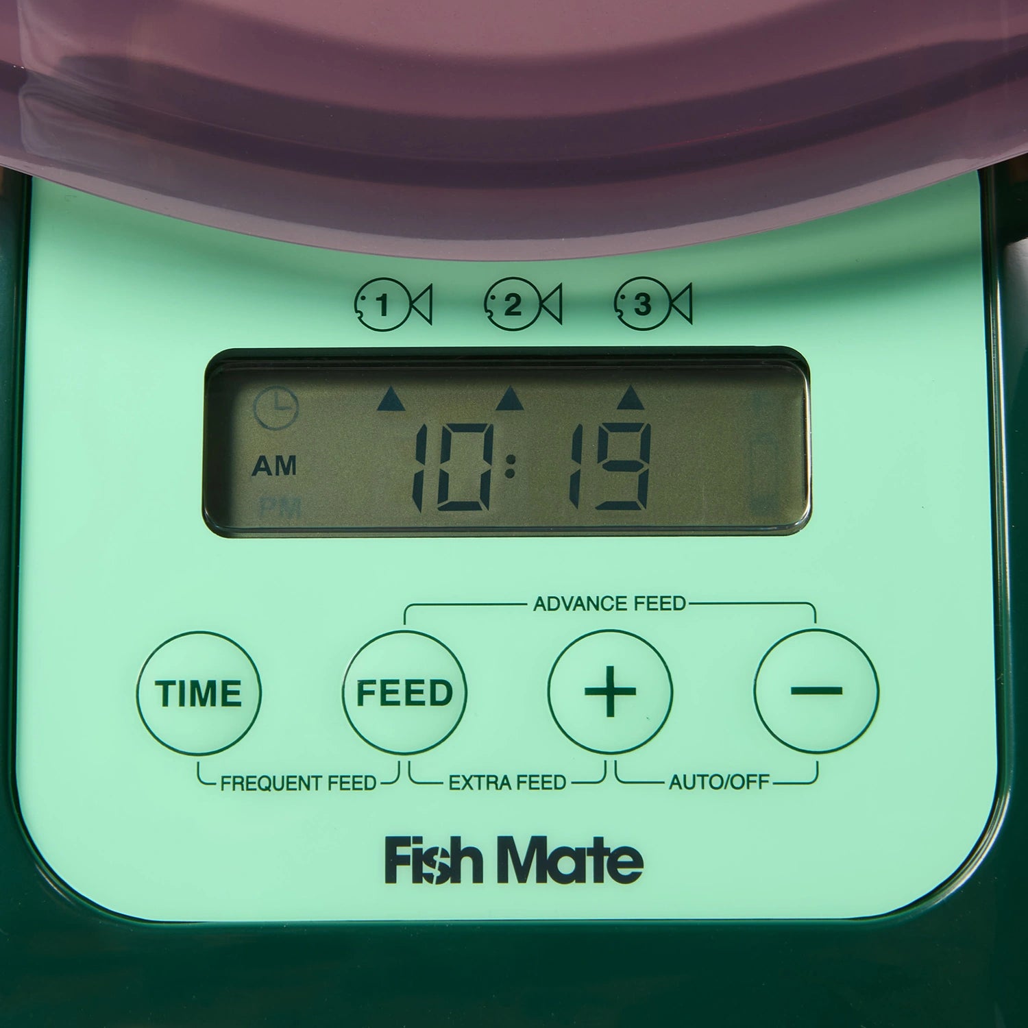 Digital timer control panel of a Fish Mate  pond fish feeder with green display and purple top.