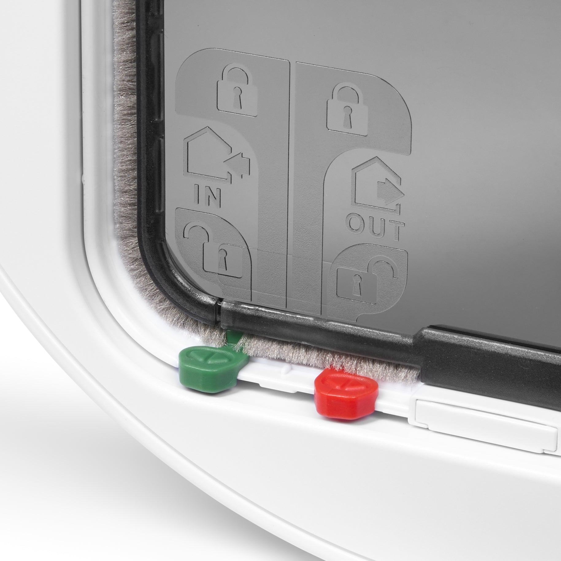 Pet door with green and red manual locks which provides four different locking options on a white background