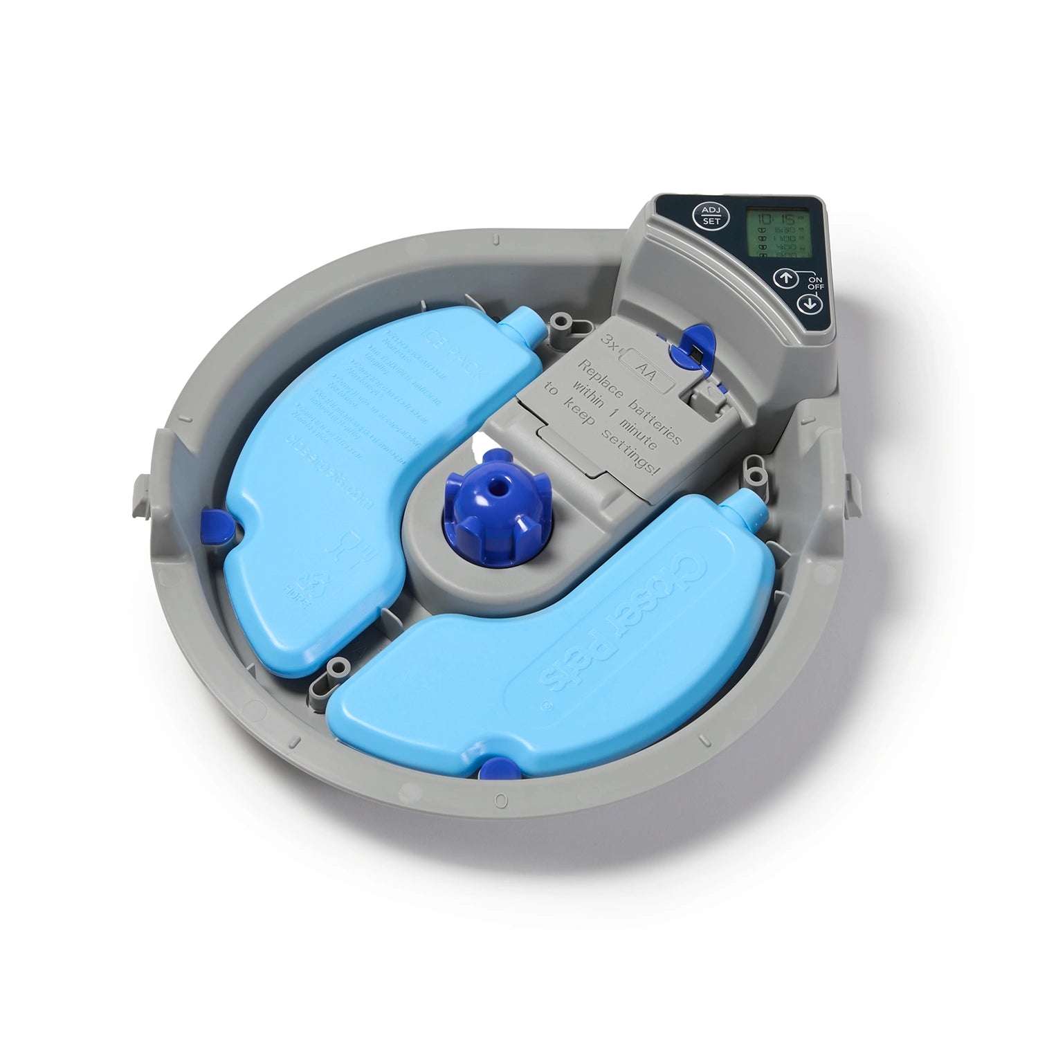 A detailed top down view of the grey base of the five meal pet feeder with two blue plastic reusable ice packs in it, on a white background