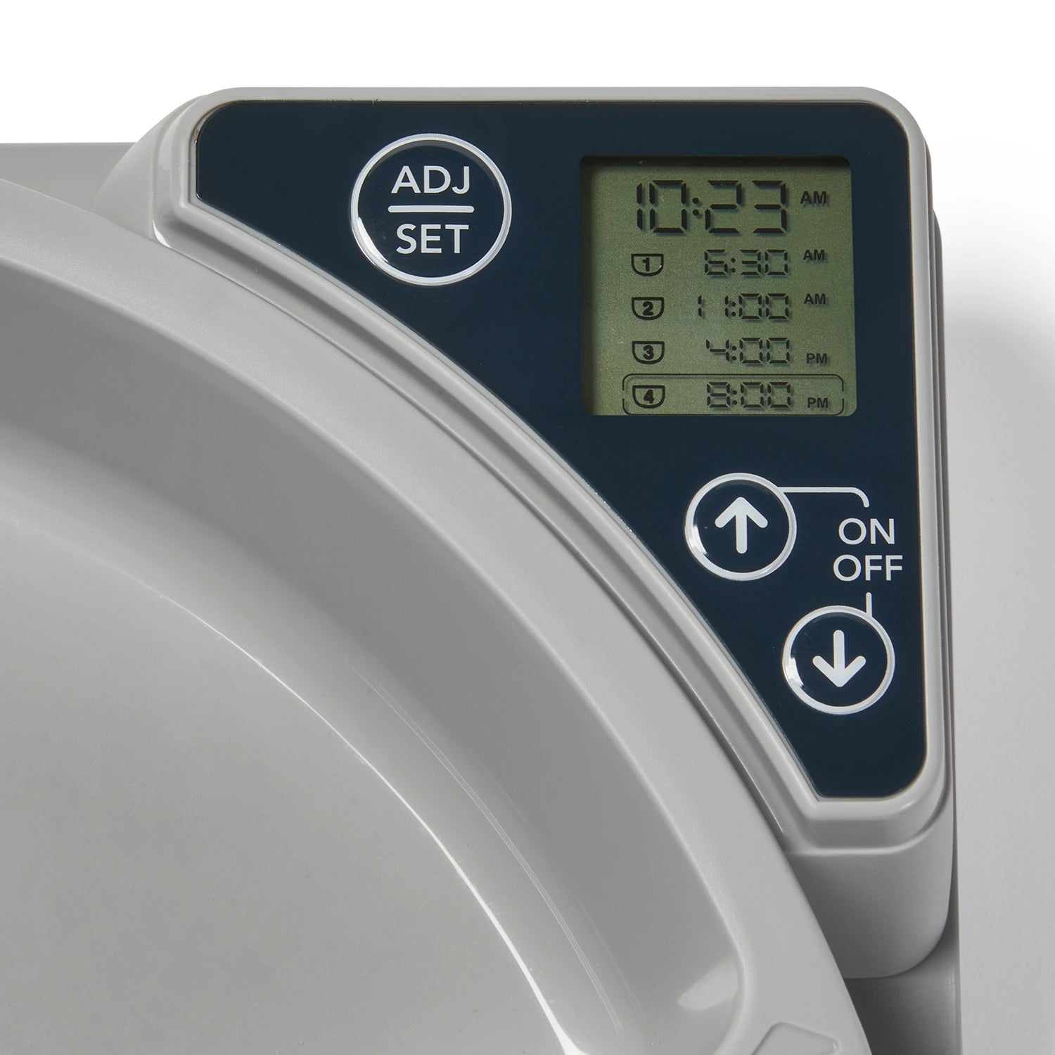 A close up view of the digital control panel for the timer on the five meal feeder, with time display and buttons , on a white background