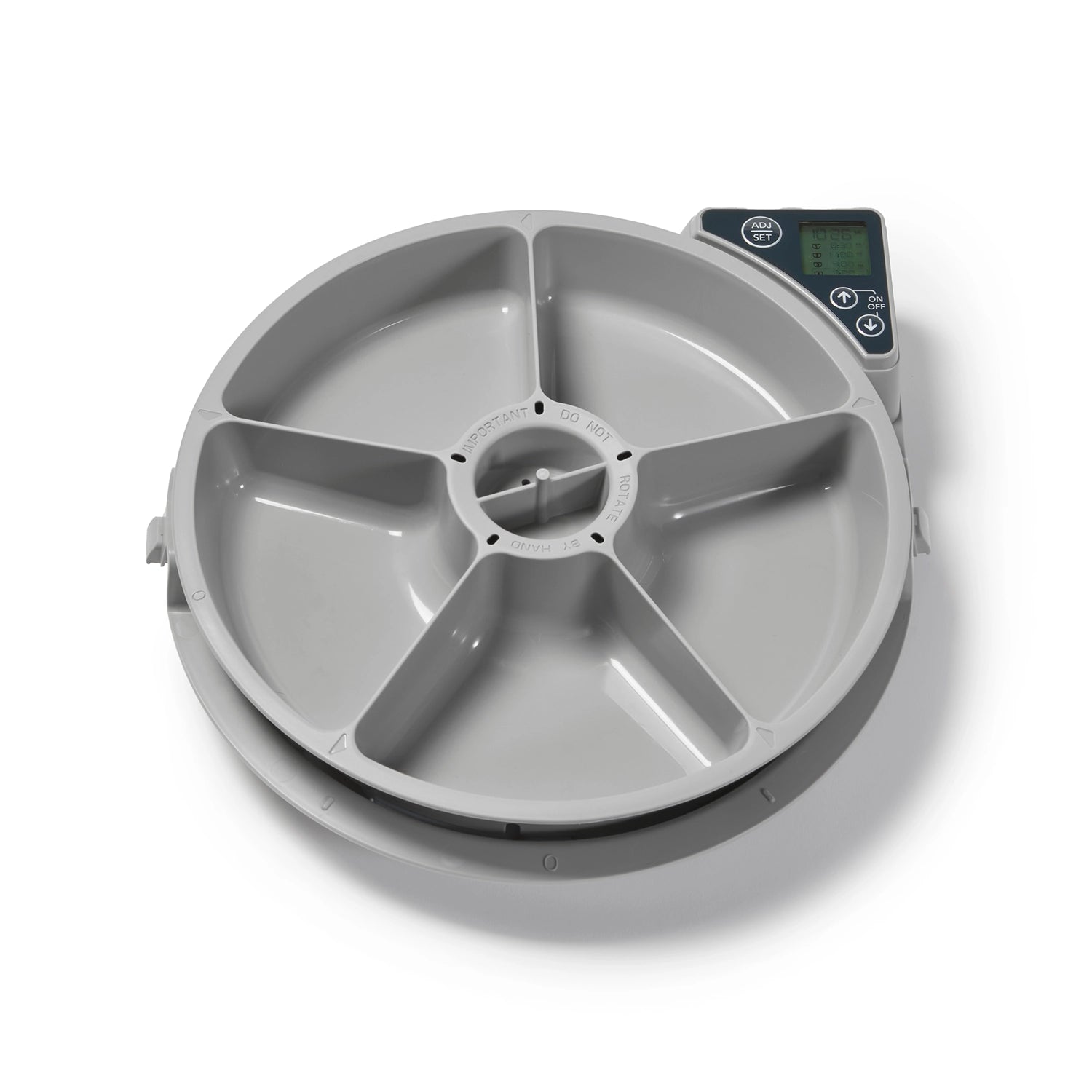 An empty grey pet food dispenser bowl with five different compartments and a digital display on a white background