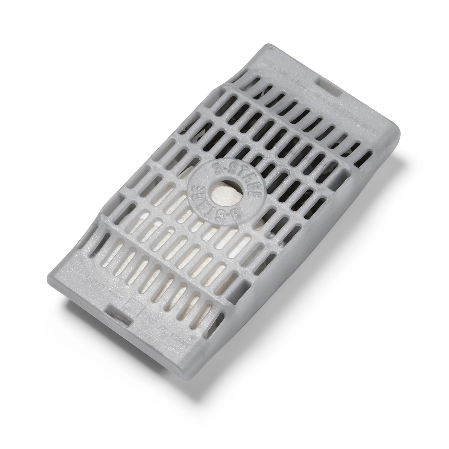 A close up view of the back of an empty filter cartridge showing the narrow holes in the casing to help trap dirt and hair to remove impurities from the pet's drinking water