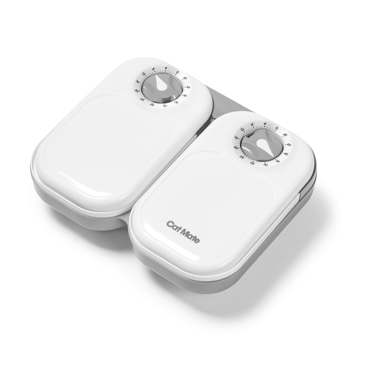 Two closed pet feeder bowl lids in white on a grey base displaying active timers on a white background