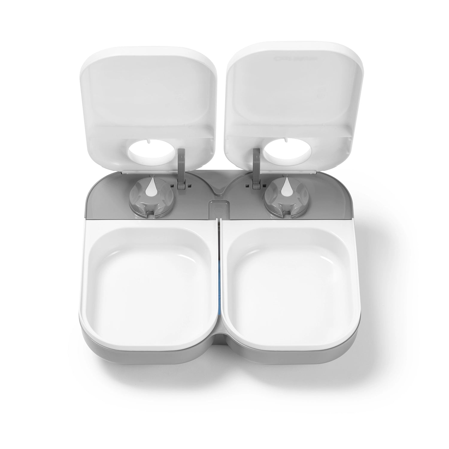 A view on the open and empty two meal pet feeder displaying the size of the food bowls on a white background