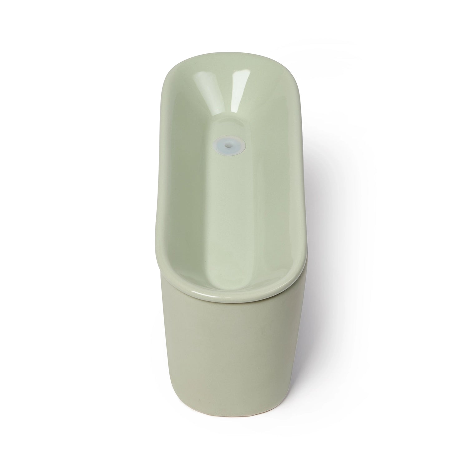 A side-on view of the empty light grey ceramic cat drinking fountain which is powered by a USB cable and made by Cat Mate, on a white background