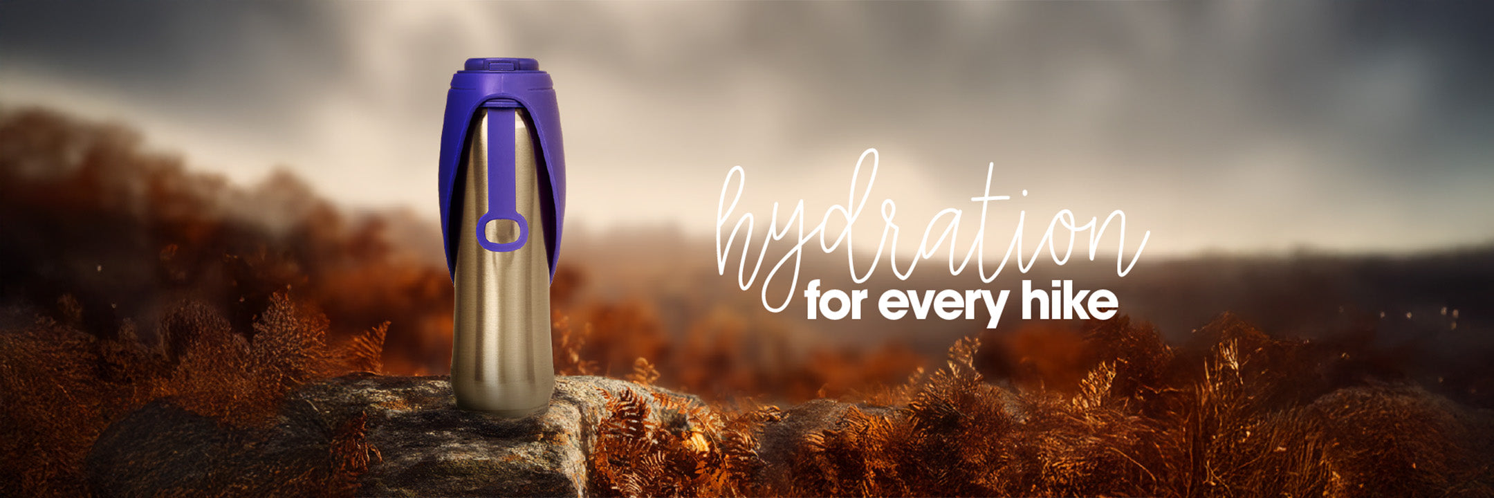 Hydration bottle with 'hydration for every hike' text against a scenic background