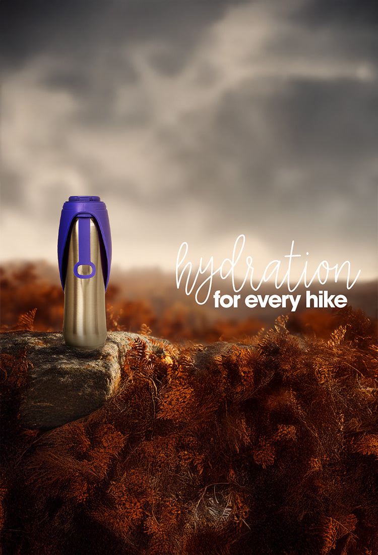 Hydration bottle on a log with autumn foliage and 'hydration for every hike' text