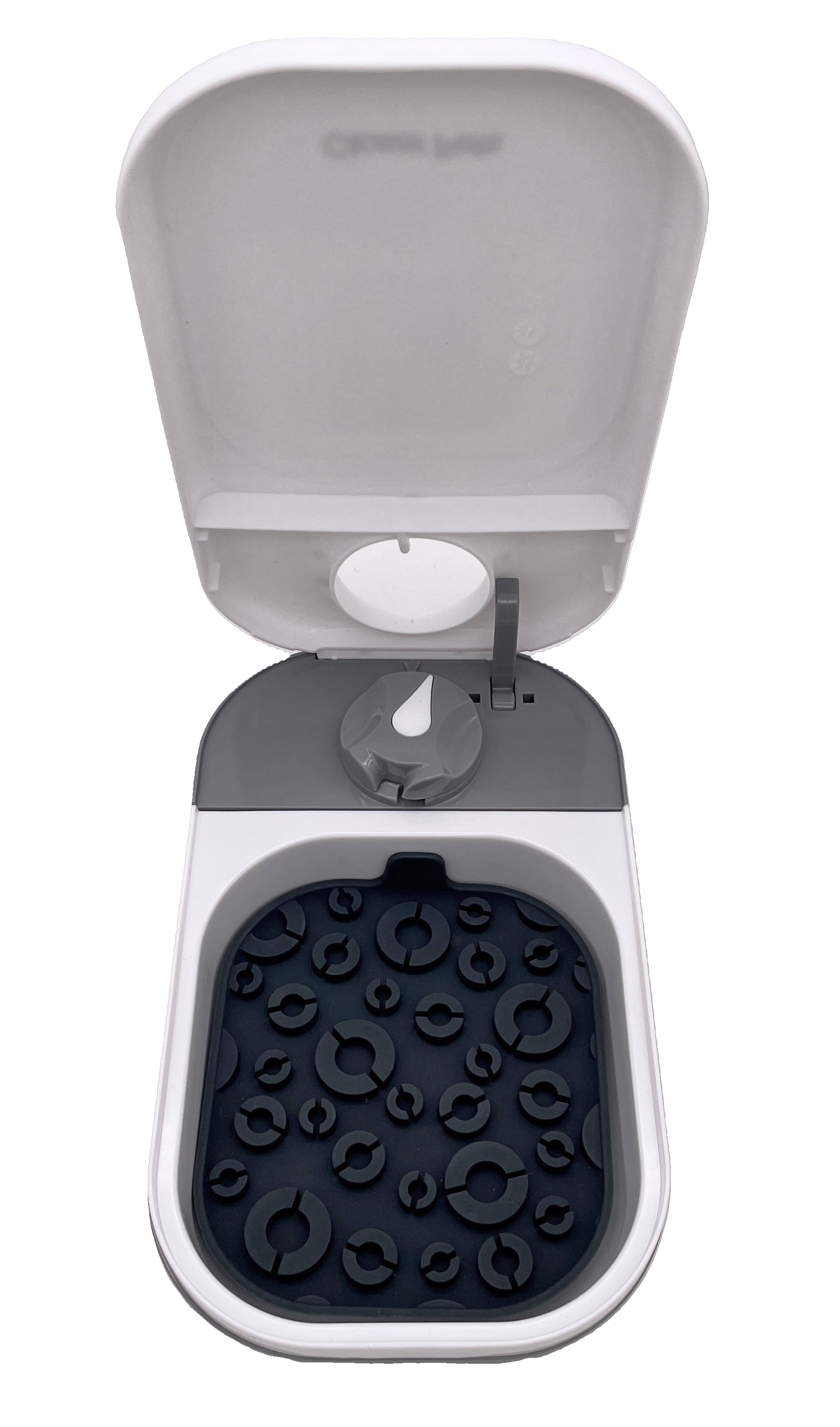 A top view of an open pet feeder with a black silicone lick mate in side the base, on a clear background