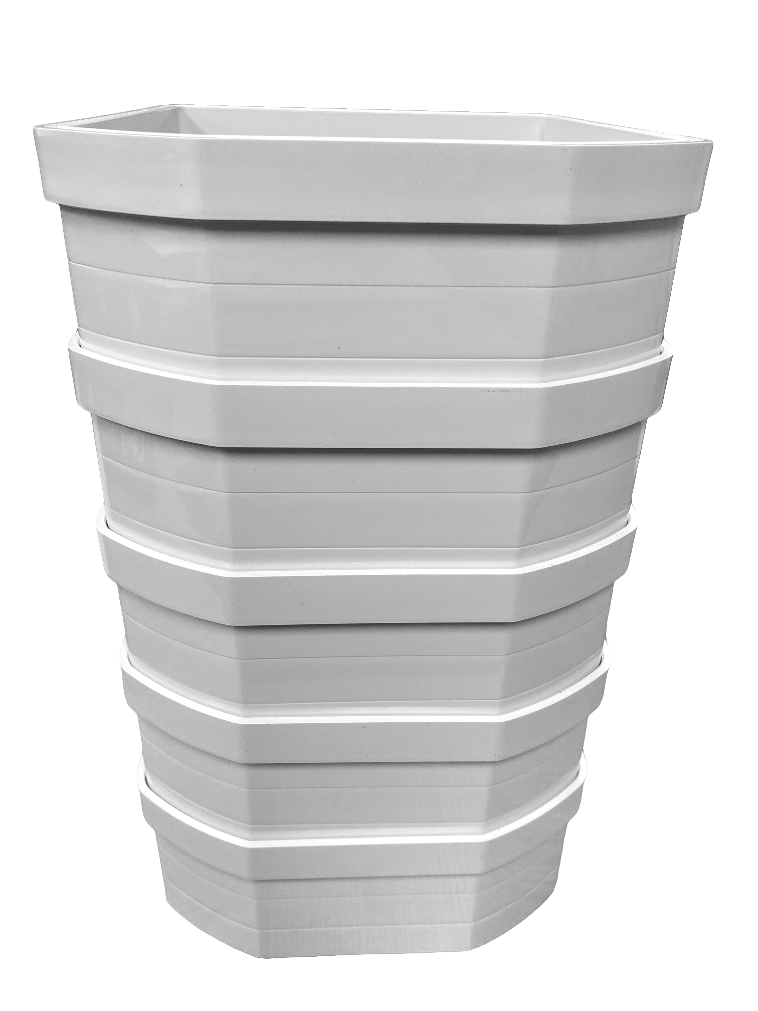 A stack of five white plastic wall liners for cat flaps, designed to extend through walls or thick installations.