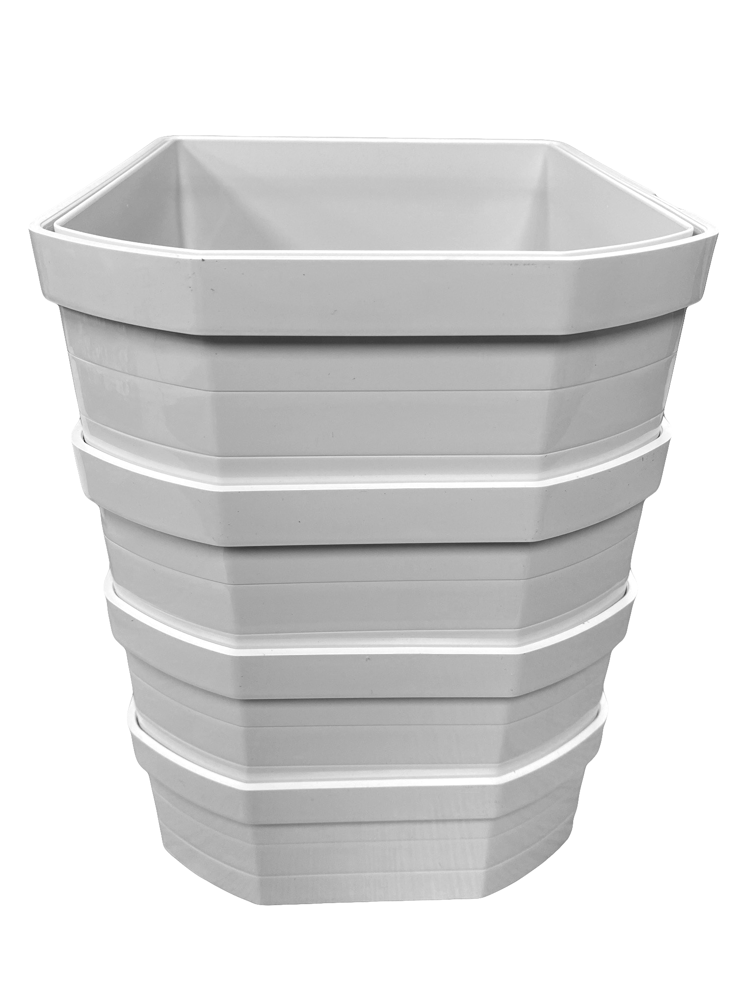 A stack of four  white plastic wall liners for cat flaps, designed to extend through walls or thick installations.