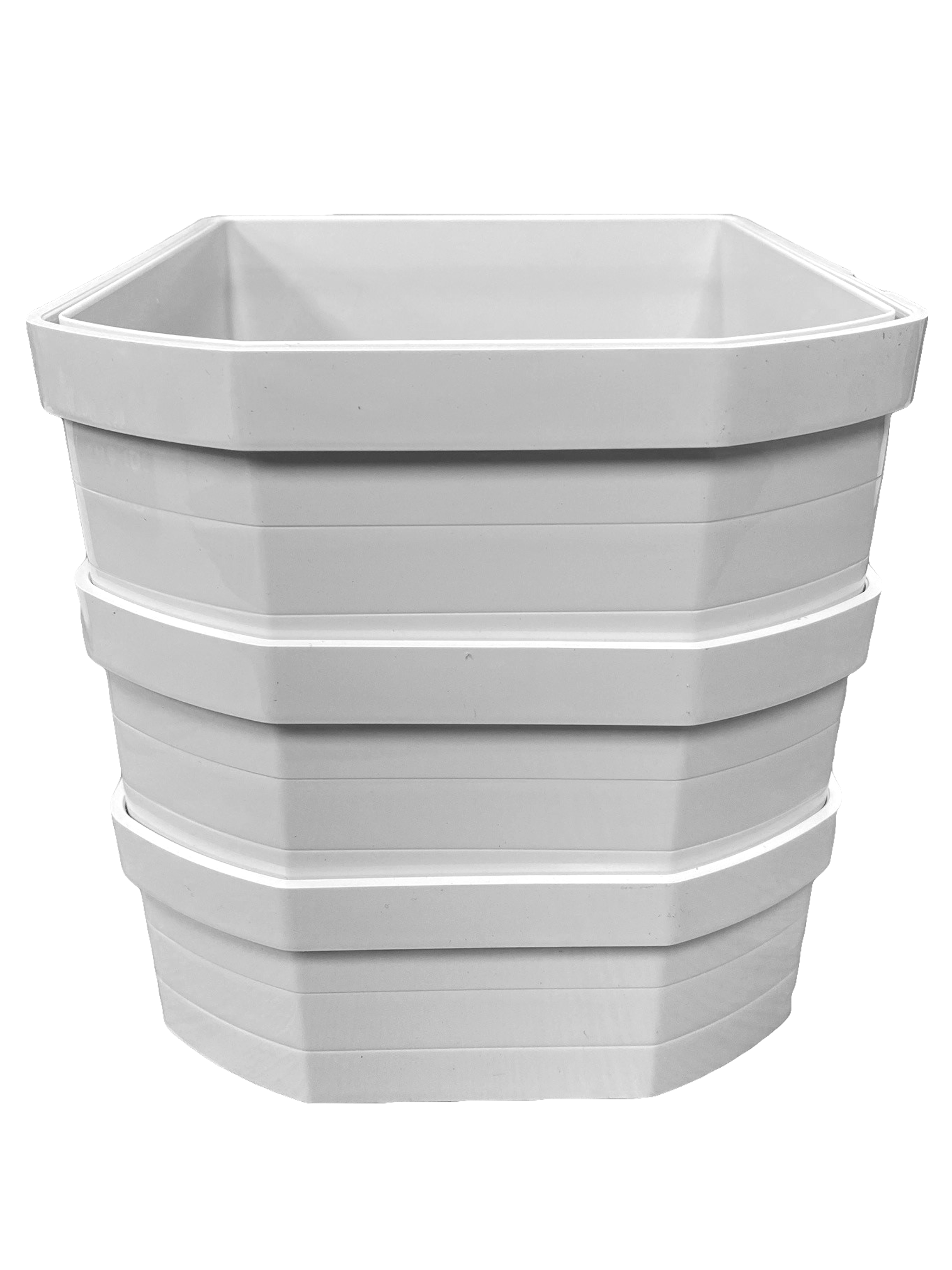 A stack of three white plastic wall liners for cat flaps, designed to extend through walls or thick installations.