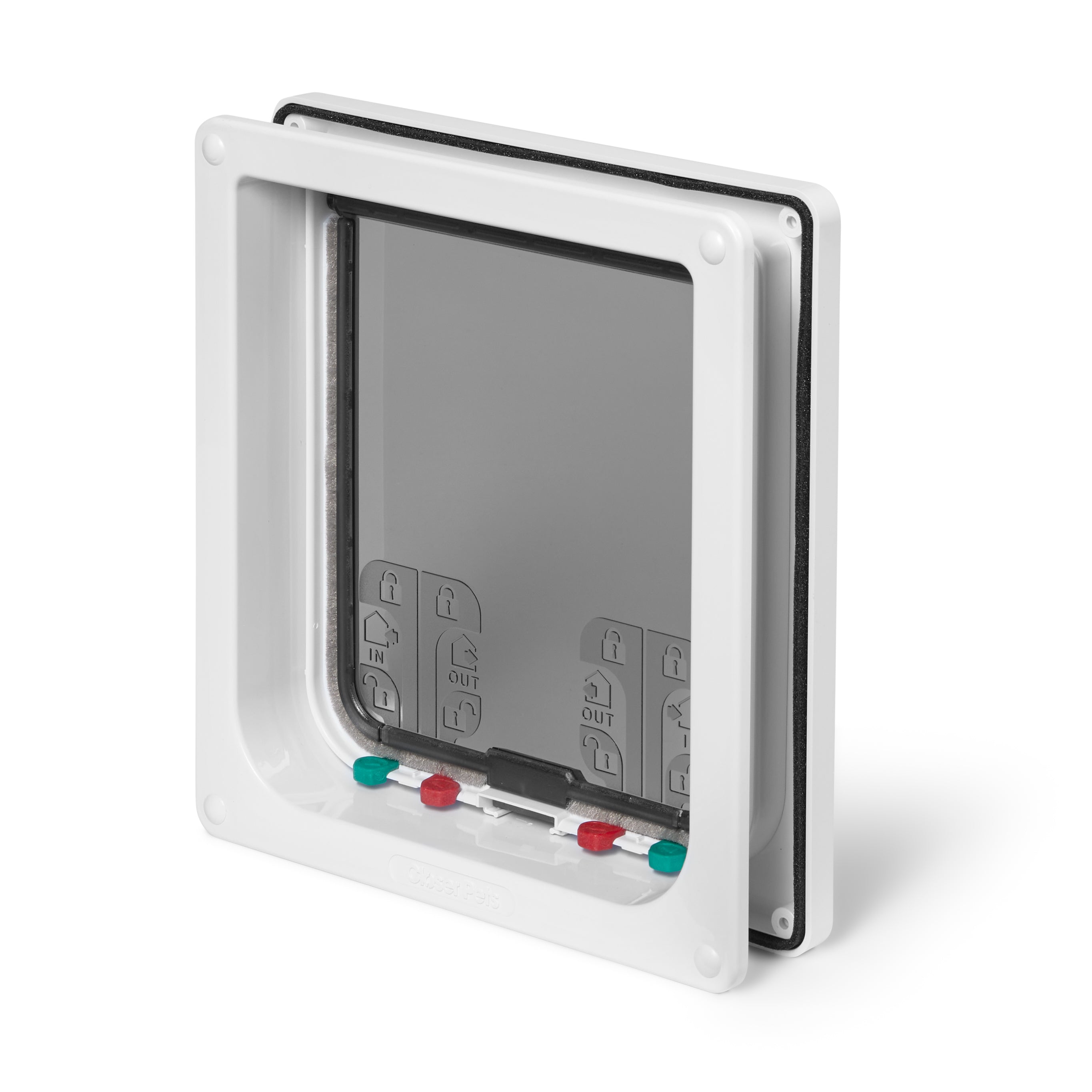 An angled view of the manually locked pet flap and white door frame which is self-lining up to two inches thick 