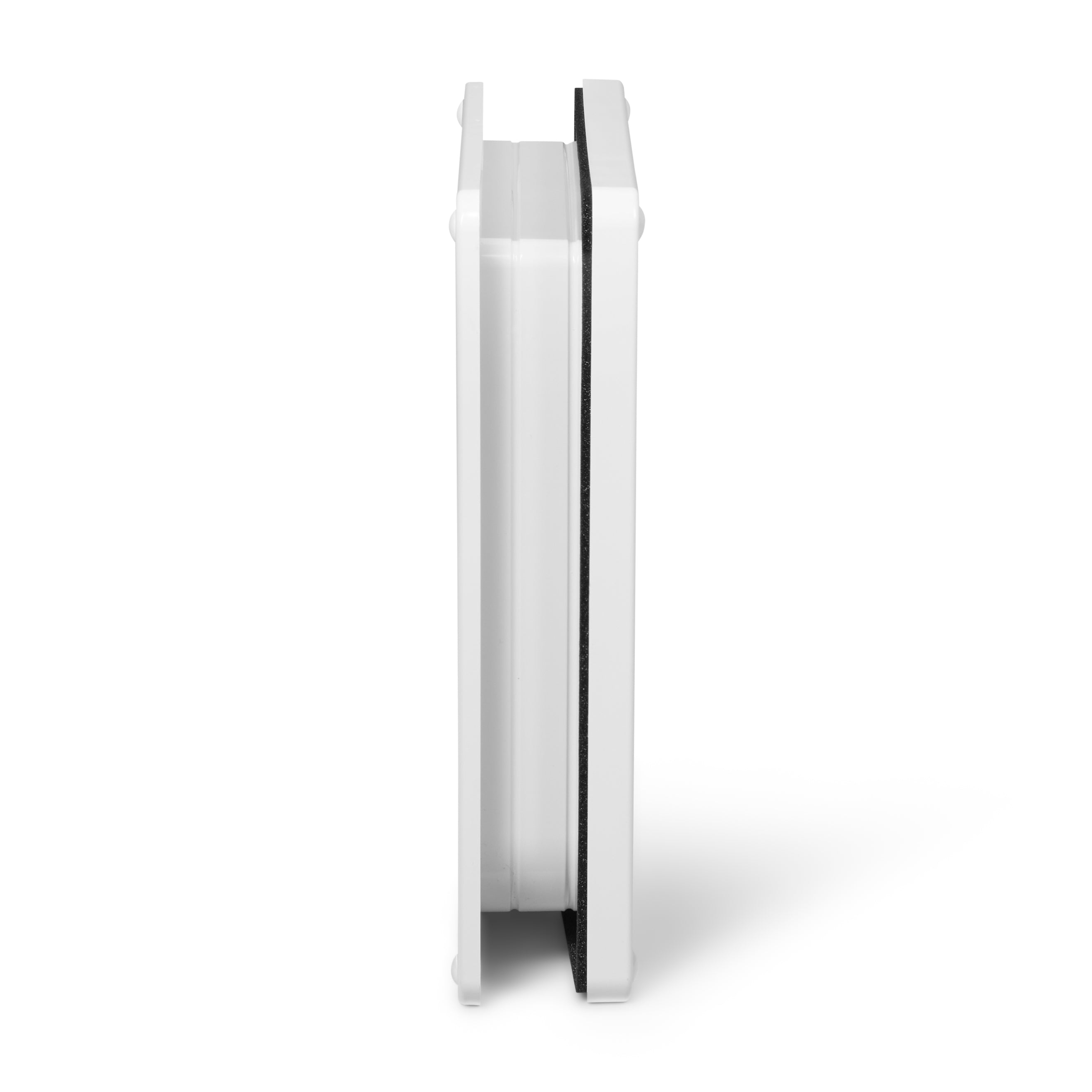 A profile view of the white pet door which is self lining up to two inches and can be installed in to a variety of door types 