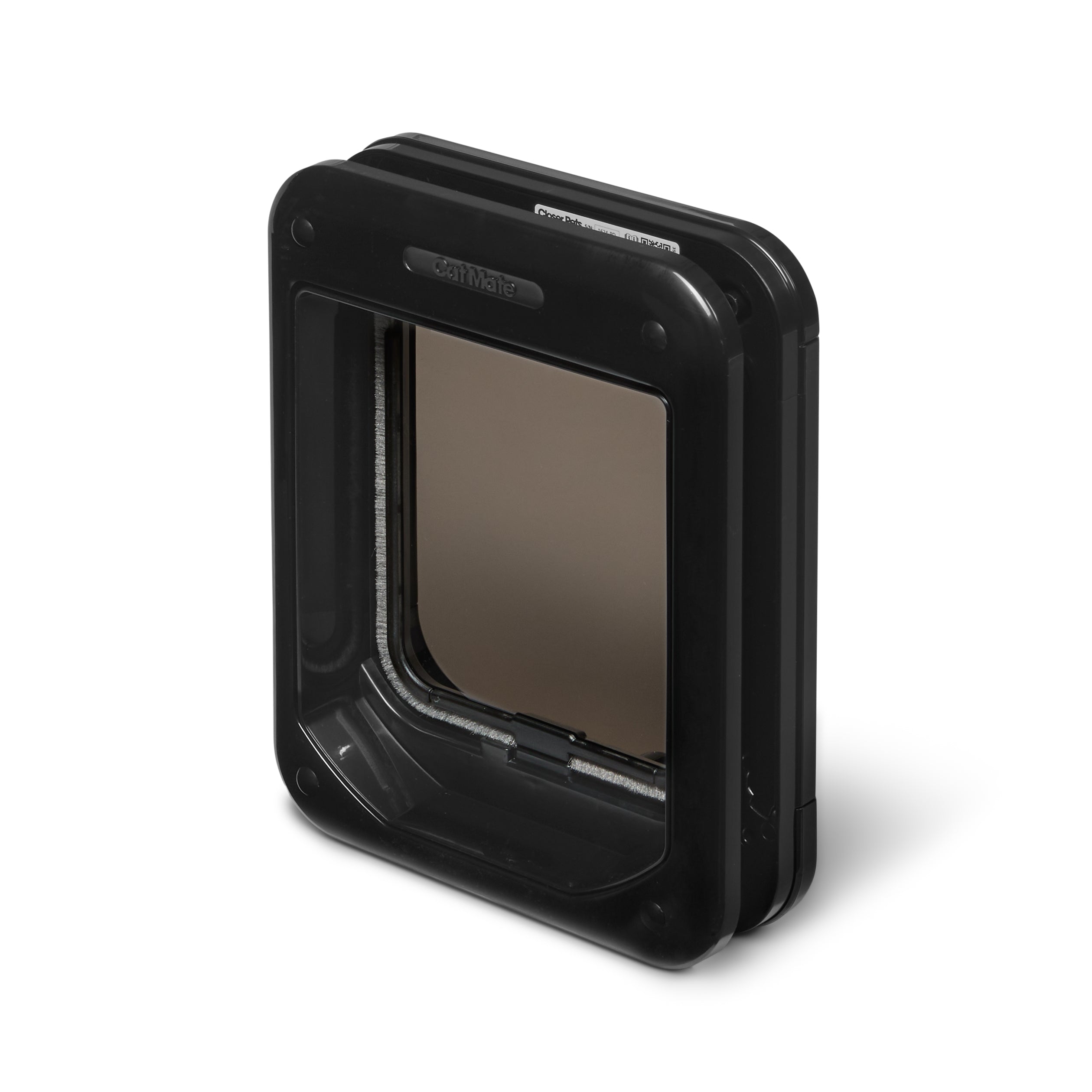 An angled view of the back of the cat flap which displays the draft-proof and weather-proof brushing, with a magnetic closure