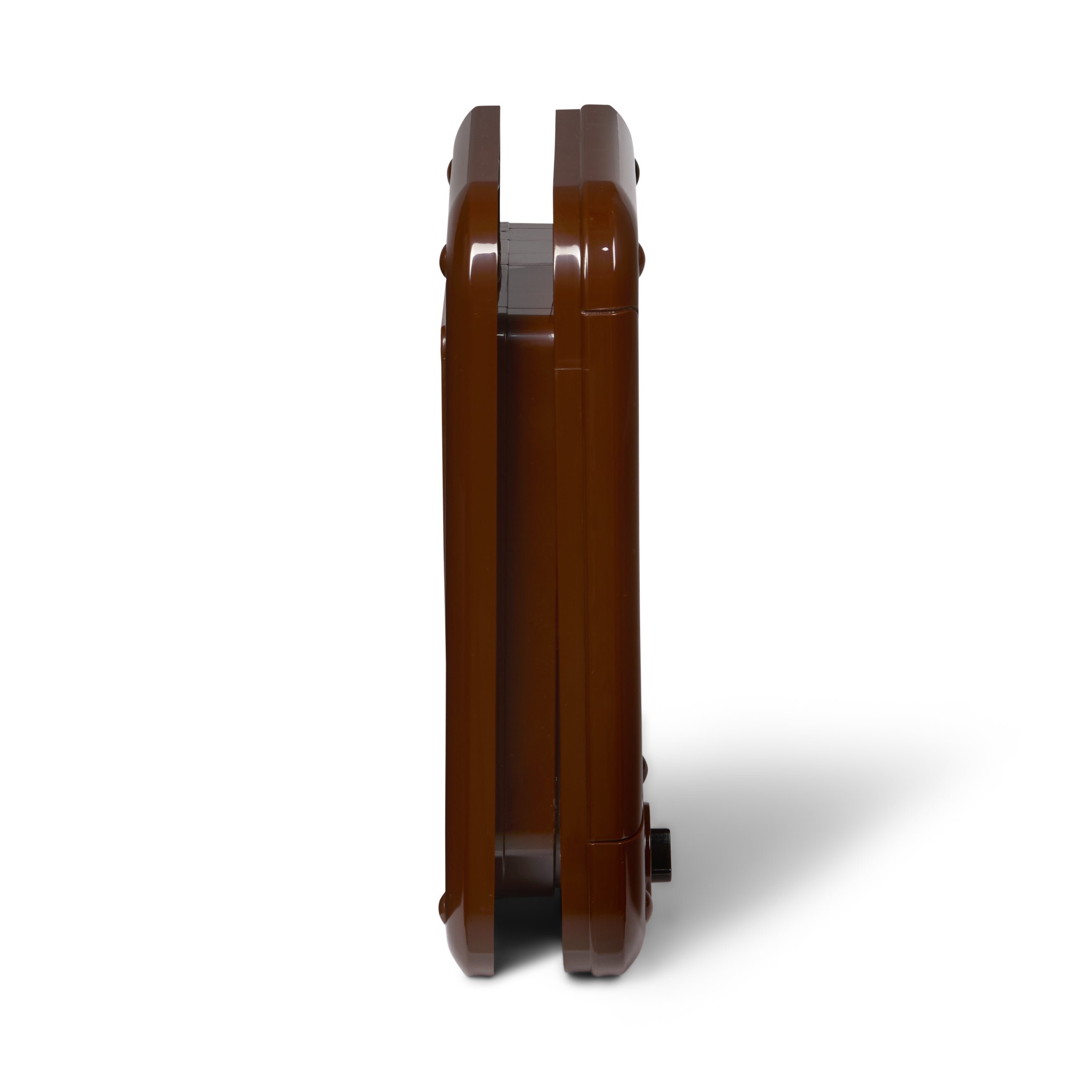 A profile view of the brown manual cat flap made by Cat Mate, which is self-lining up to two inches thick and is suitable for installation in to various types of door, wall and even glass, on a white background 