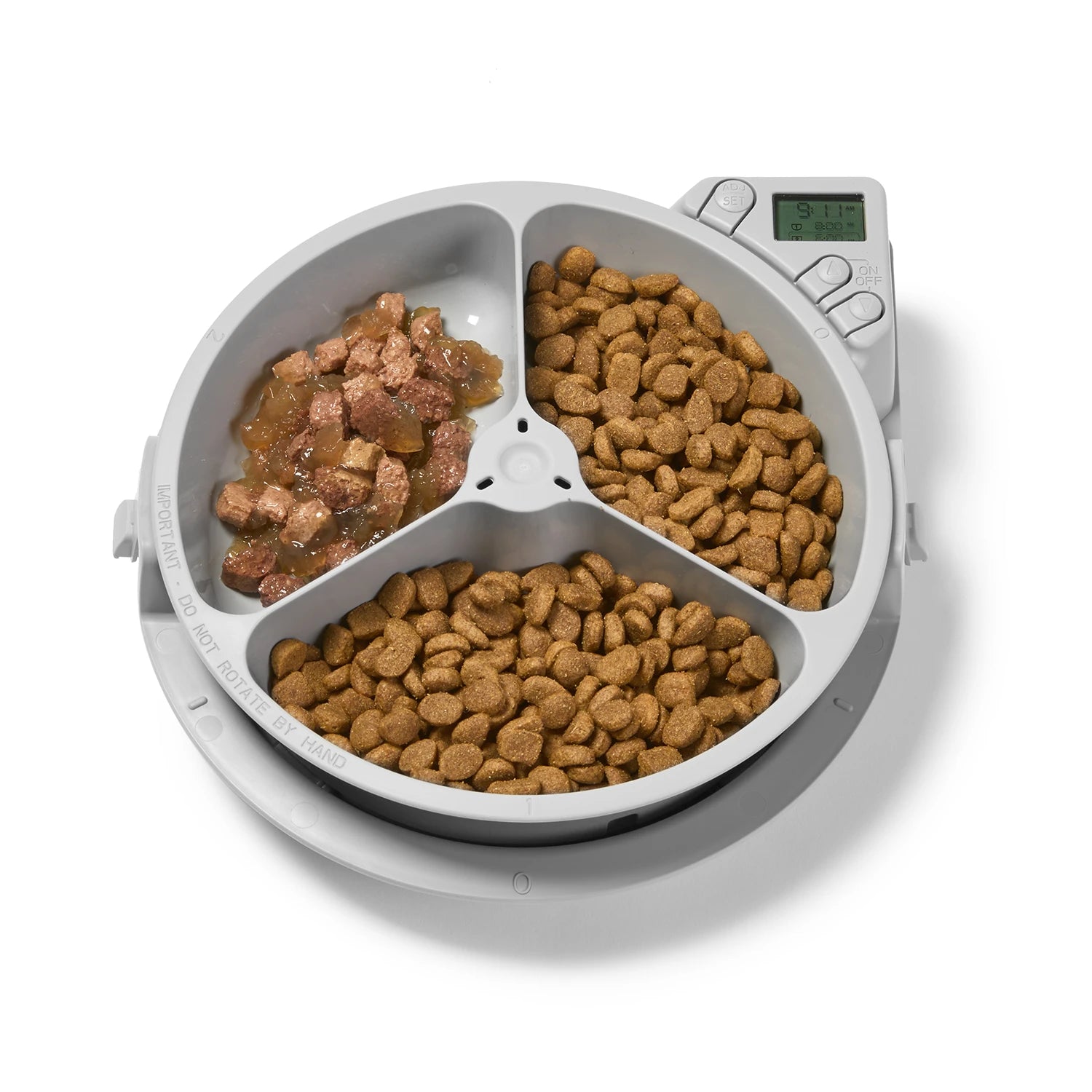 Pet food dispenser with three compartments filled with different types of pet food on a white background.